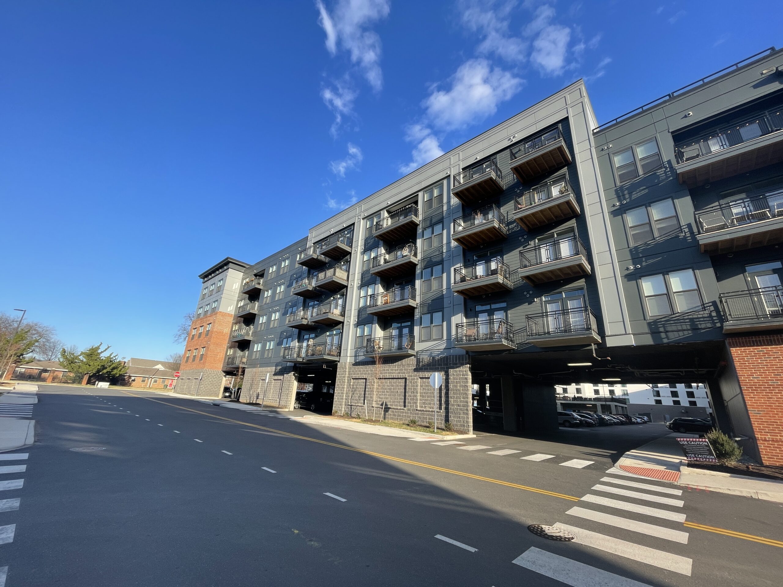 Black, gray, and brick apartments with balconies in Richmond, Virginia.