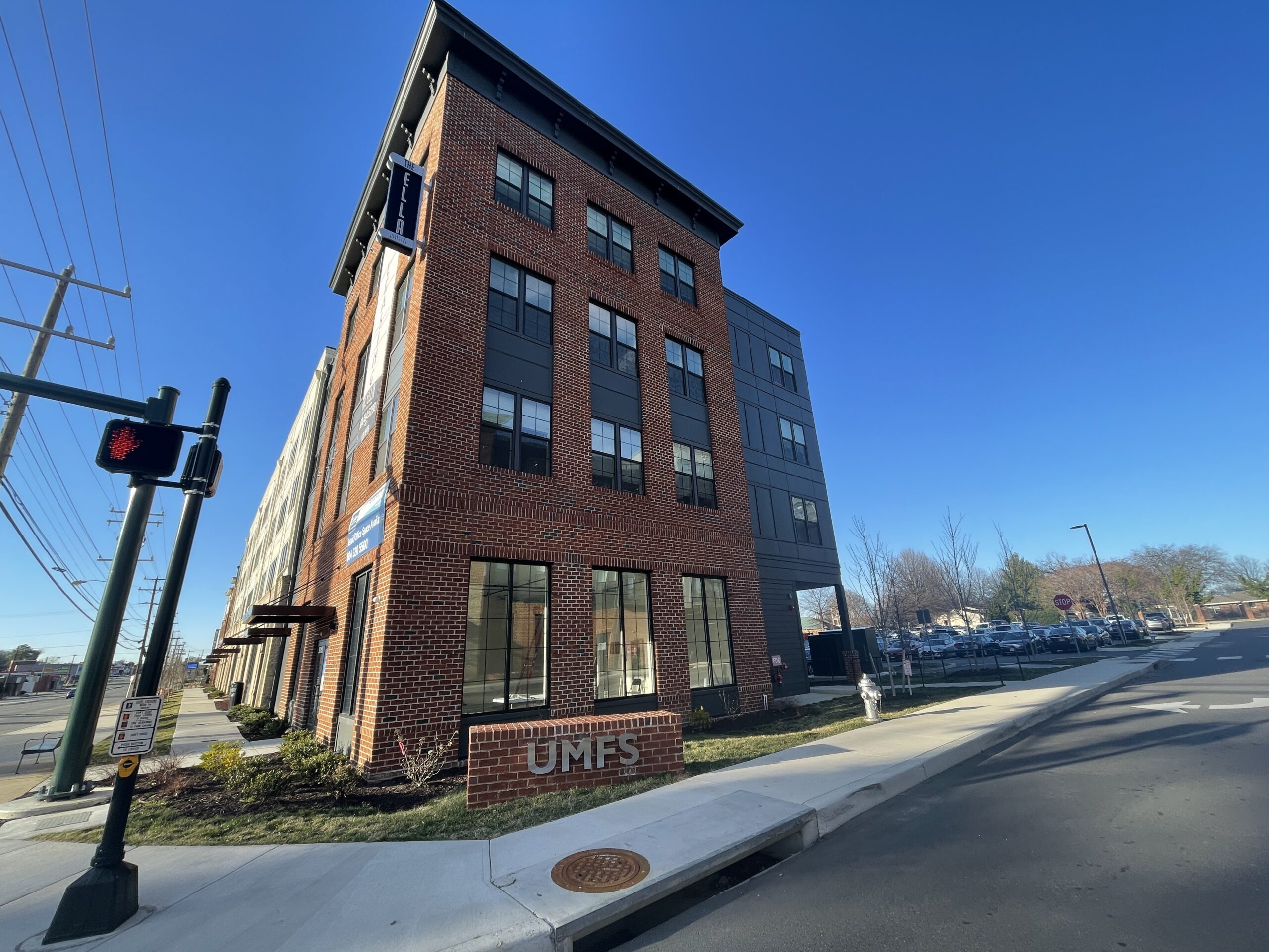 Brick apartments in front of UMFS sign in Richmond, Virginia