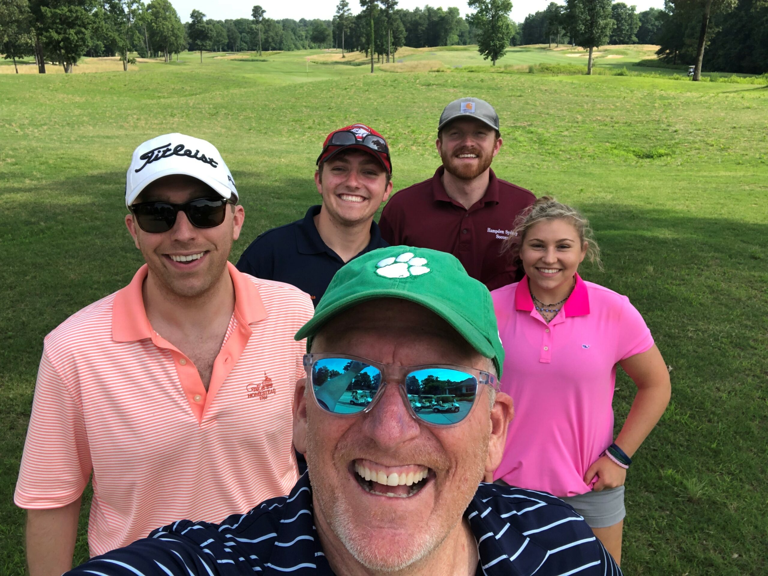 Chris and his kids playing golf