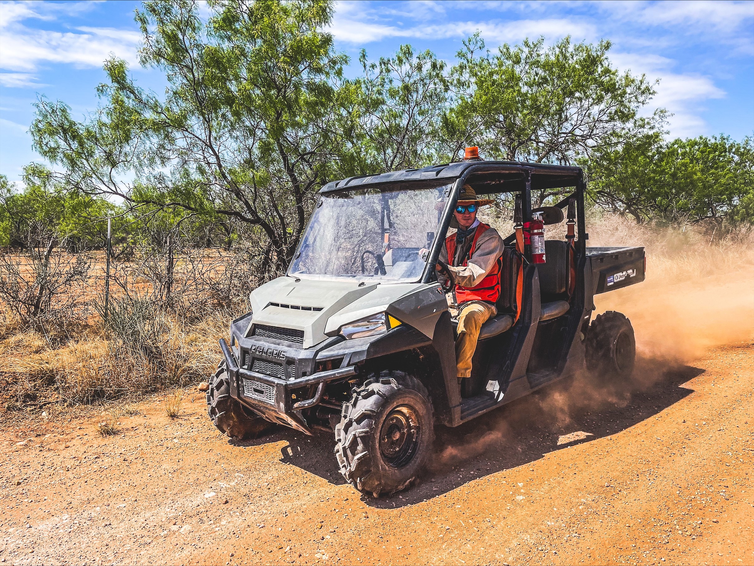 Richmond environmental team member riding in utility vehicle.