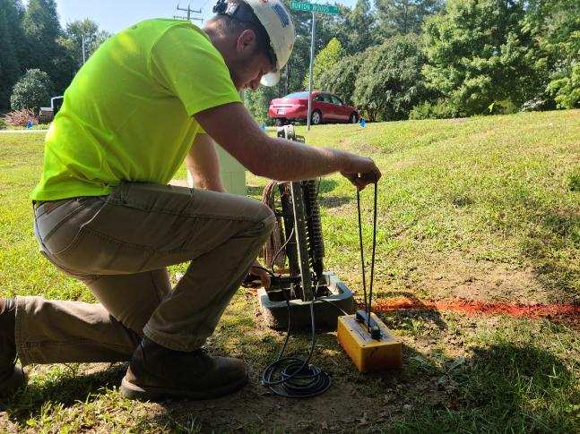 A Timmons Group SUE professional uses a Pipehorn 800HL Pipe and Cable Locator to find utilities.