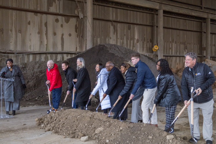 Rick Baker of Timmons Group, Mayor of Raleigh Janet Cowell, and others participate in a groundbreaking ceremony for a new affordable housing project at Gresham Lake in Raleigh.